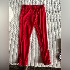 Adorable red zyia jogger pants with zipper detail. Size small.